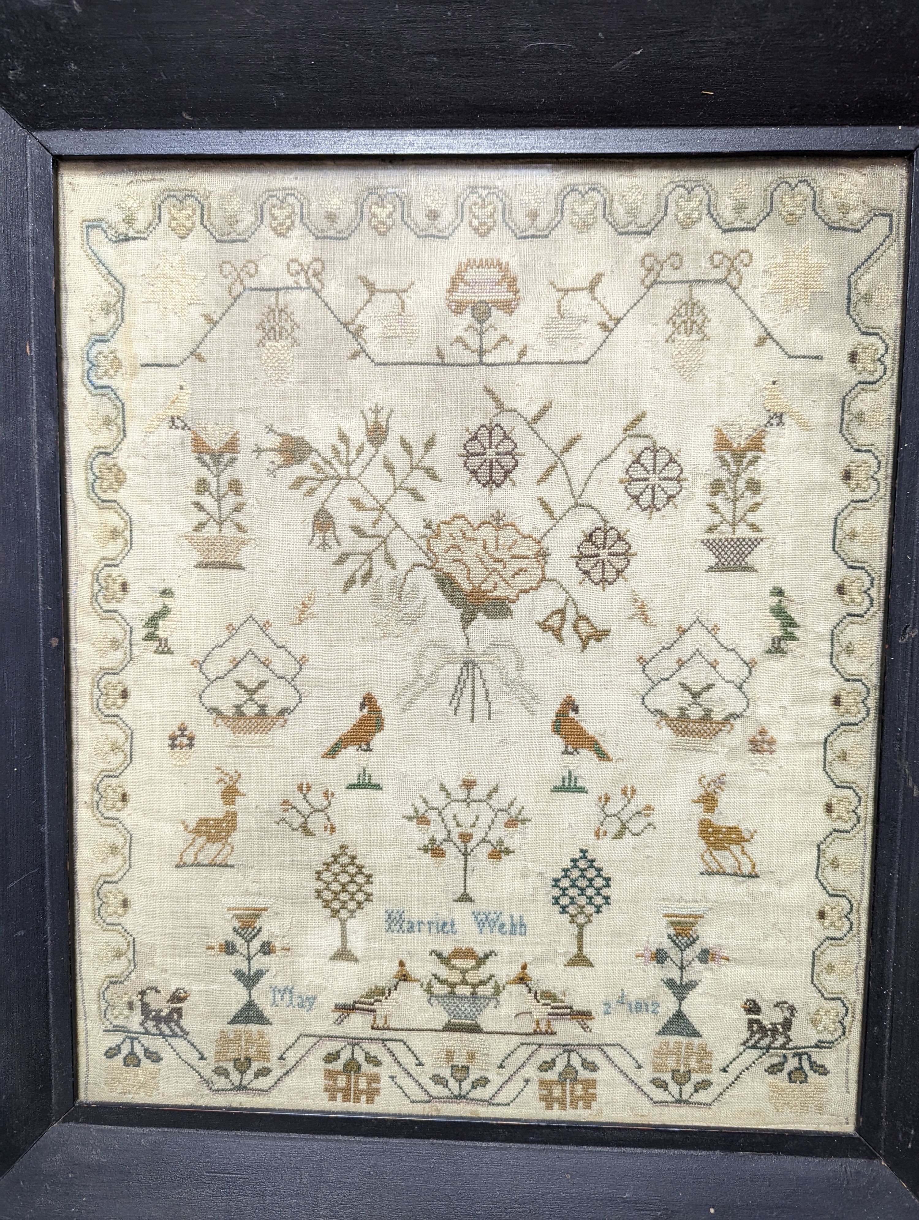 A dated 1812 sampler by Harriet Webb, framed 37x31cm excl frame